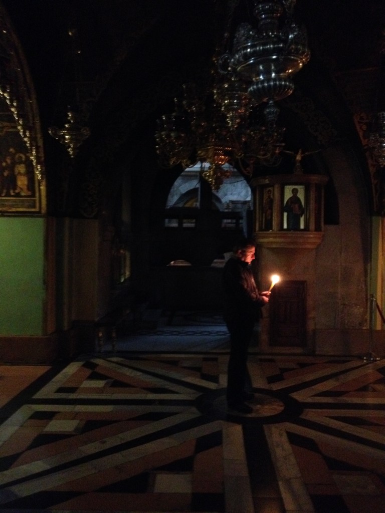 Man praying at the Armenian altar in the Church of the Holy Sepulcher.